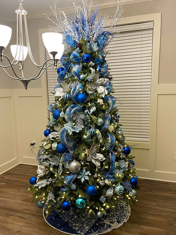 christmas trees decorated in blue